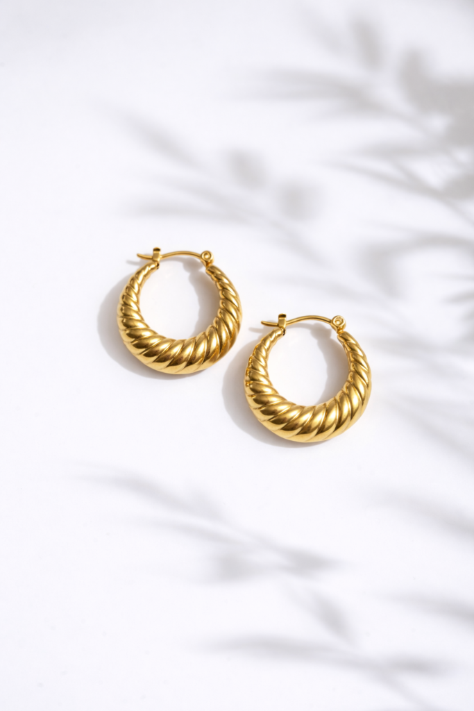 Golden twist hoop earrings by Auryn Jewells