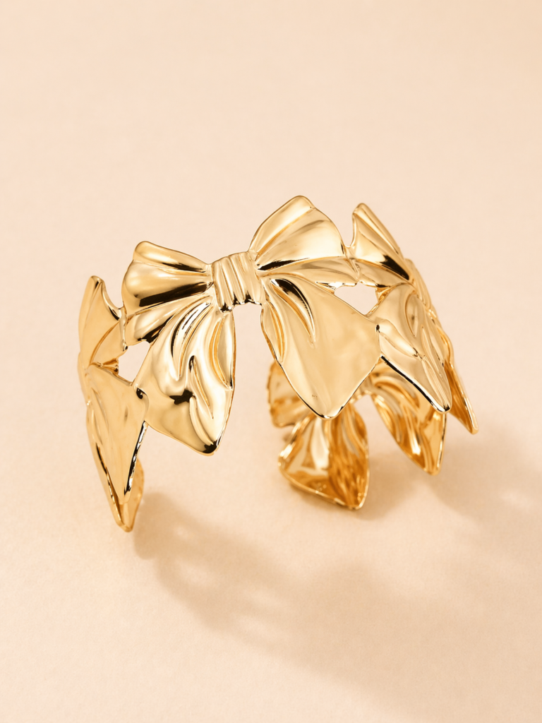 golden bow statement cuff by auryn jewells